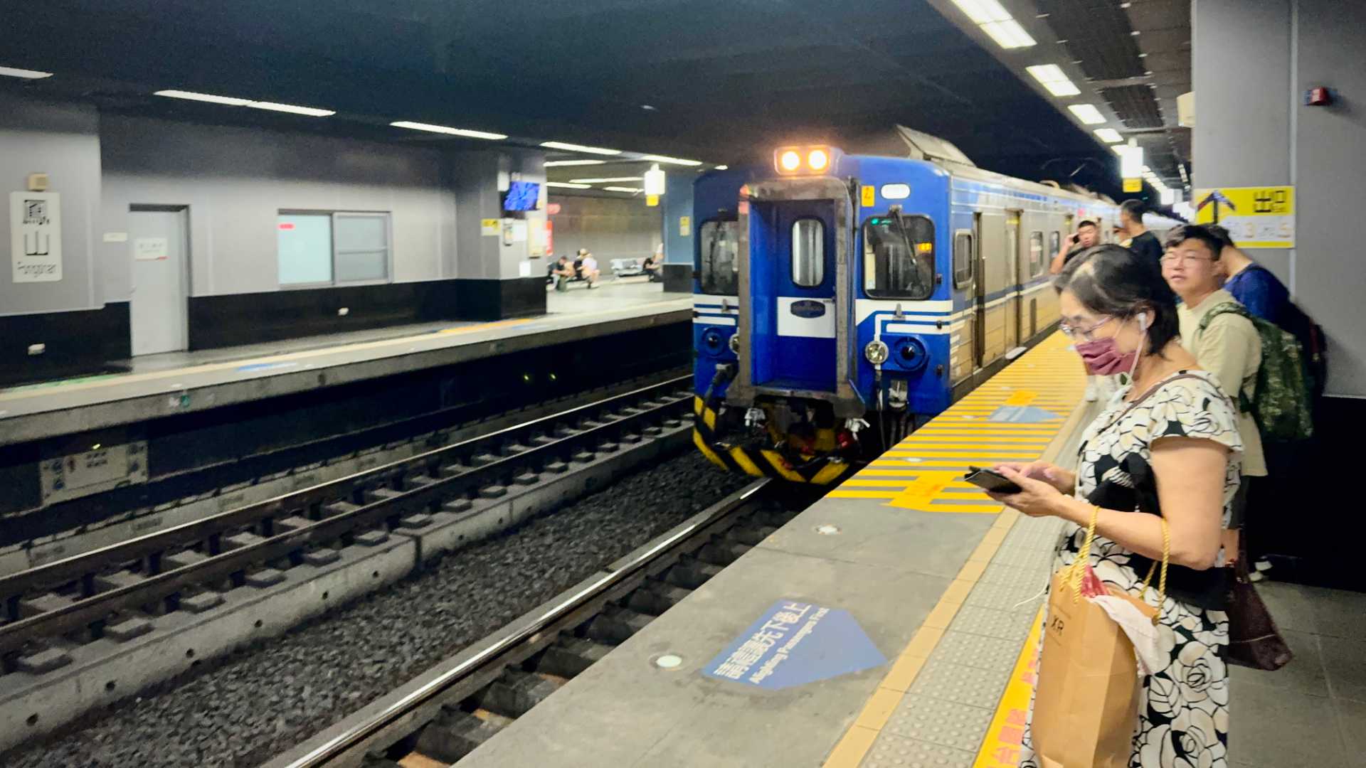 A commuter train arriving at an underground platform at Fongshan Station, Kaohsiung.