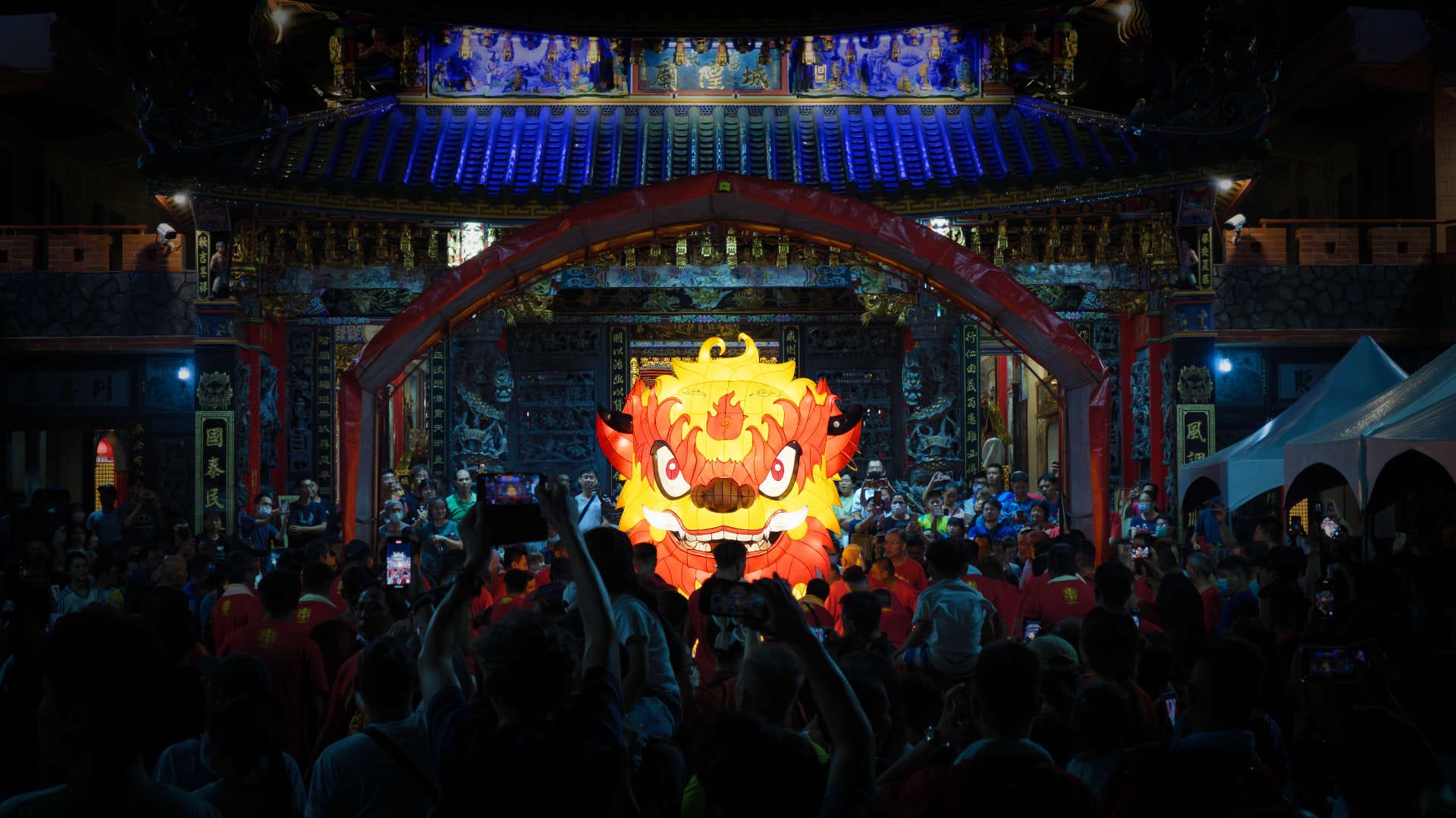 A huge Fire Lion lantern on display to crowds of people outside Fengyi Old City Chenghuang Temple in Zuoying, Kaohsiung, Taiwan, as part of the 10,000 Years Festival.