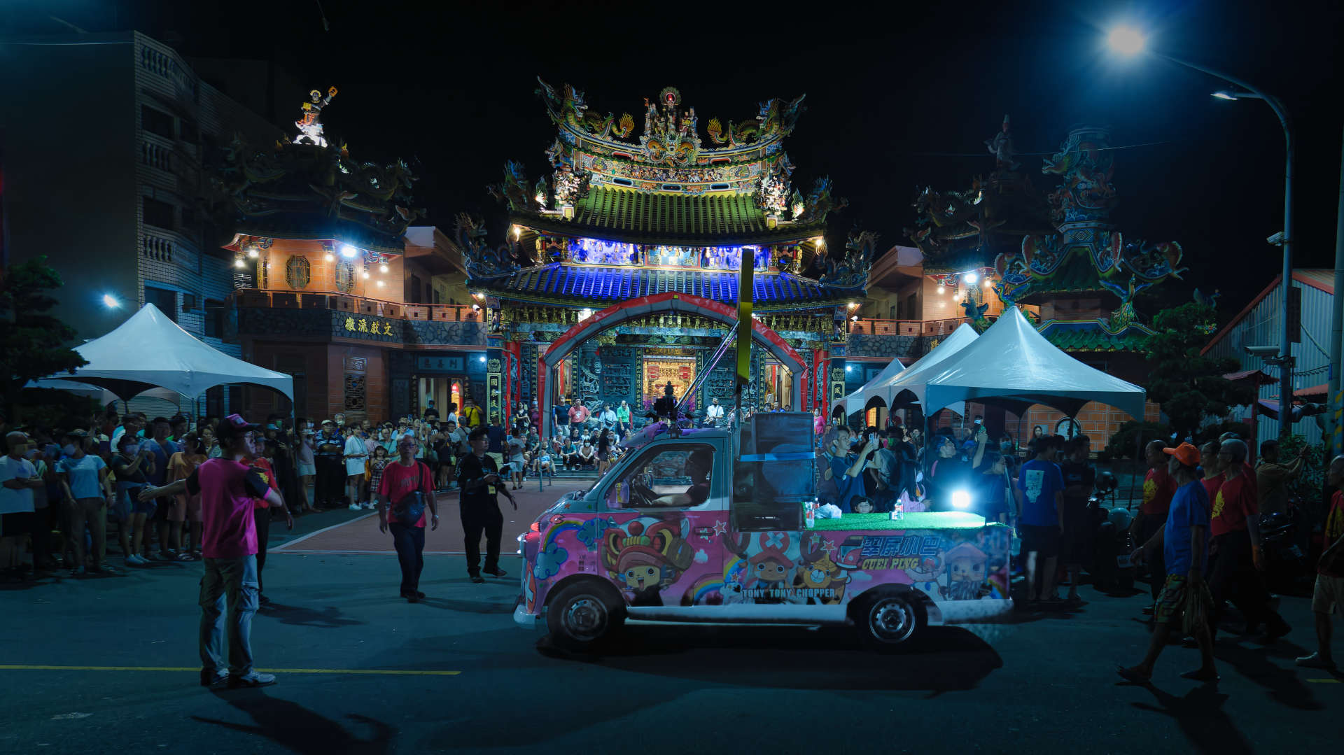 A colorfully-decorated truck featuring the cartoon character Tony Tony Chopper, outside a temple in Zuoying District, Taiwan. The truck has multiple loudspeakers on the back.