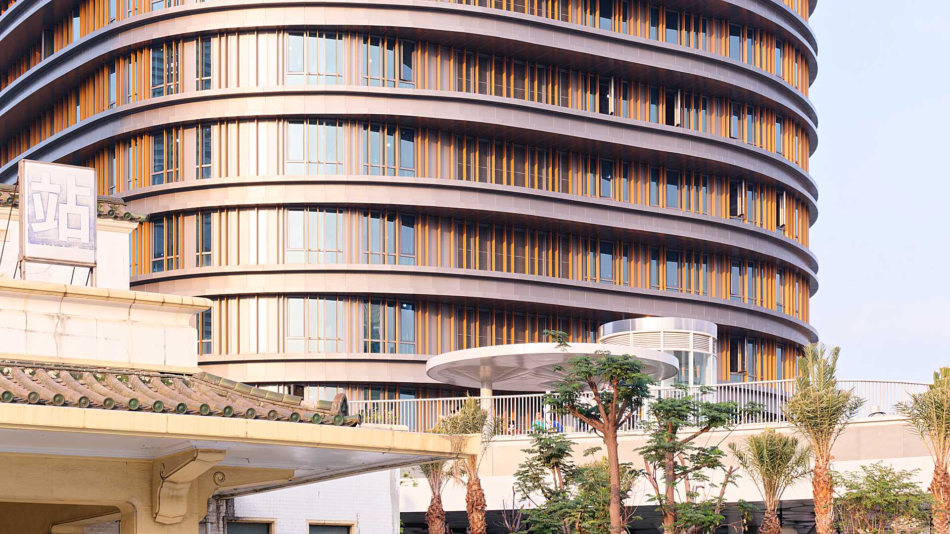 The new Kaohsiung Station hotel building behind the original station building.