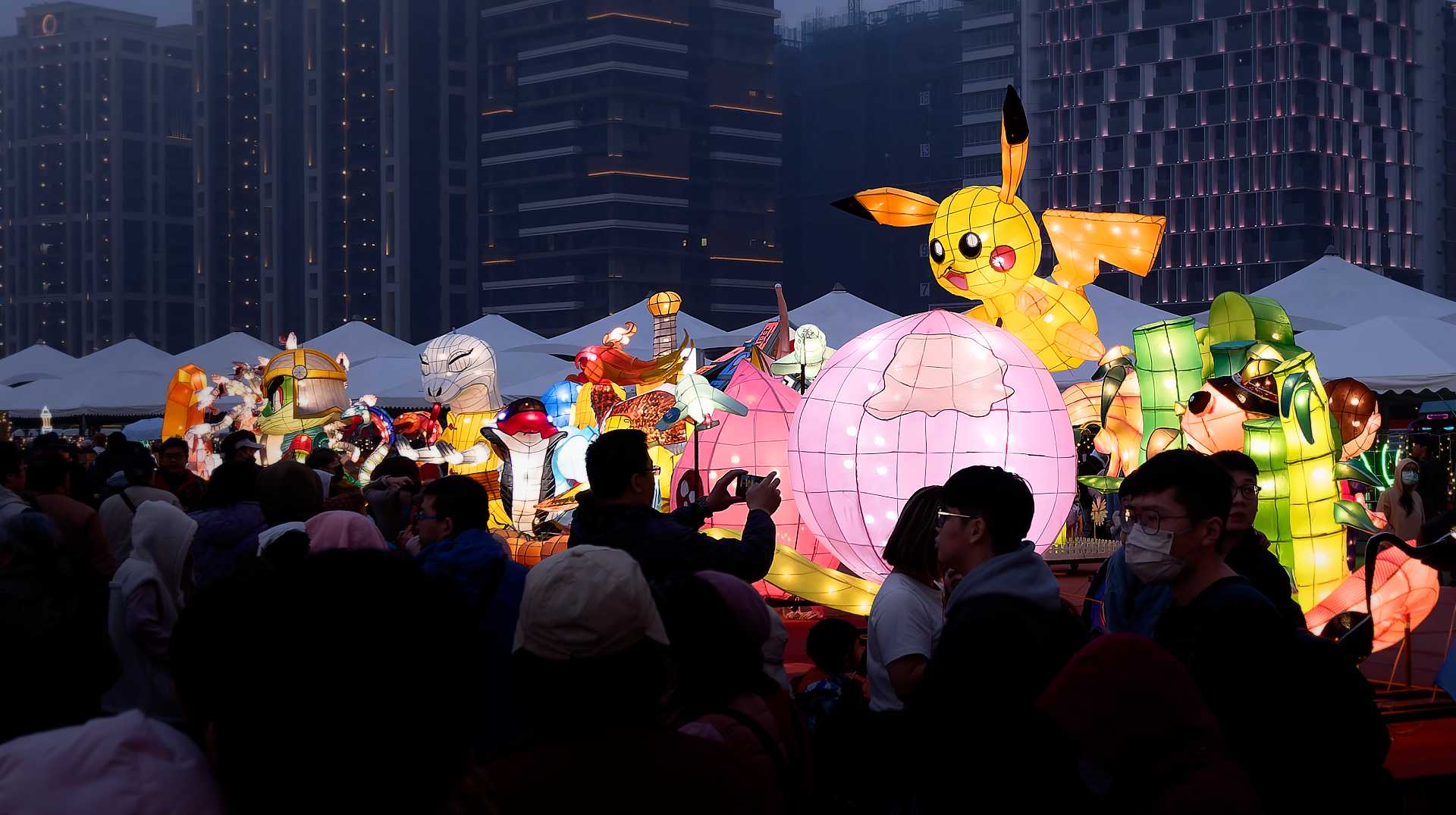 Lantern in the shape of Pikachu atop a pink orb.