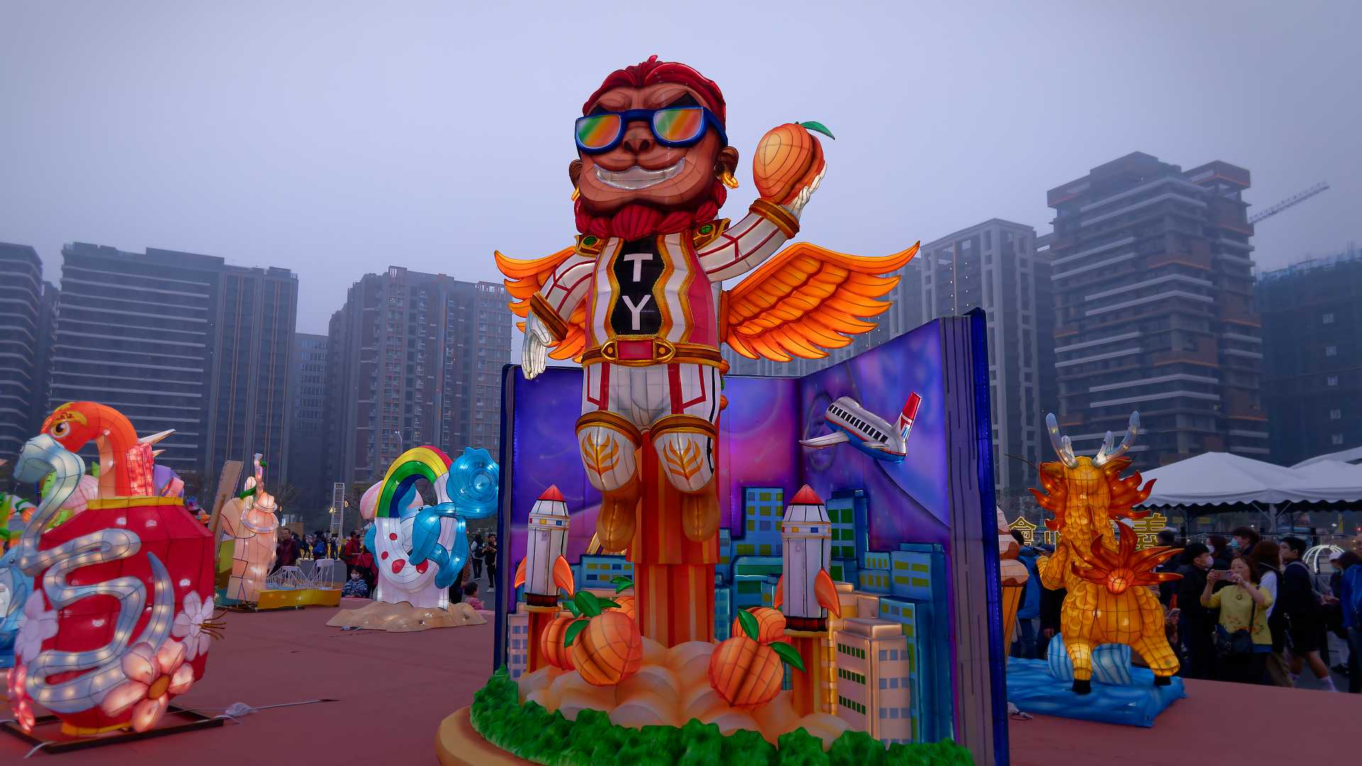 Lantern in the shape of a flying superhero with 'T' and 'Y' (representing Taoyuan) on his shirt.