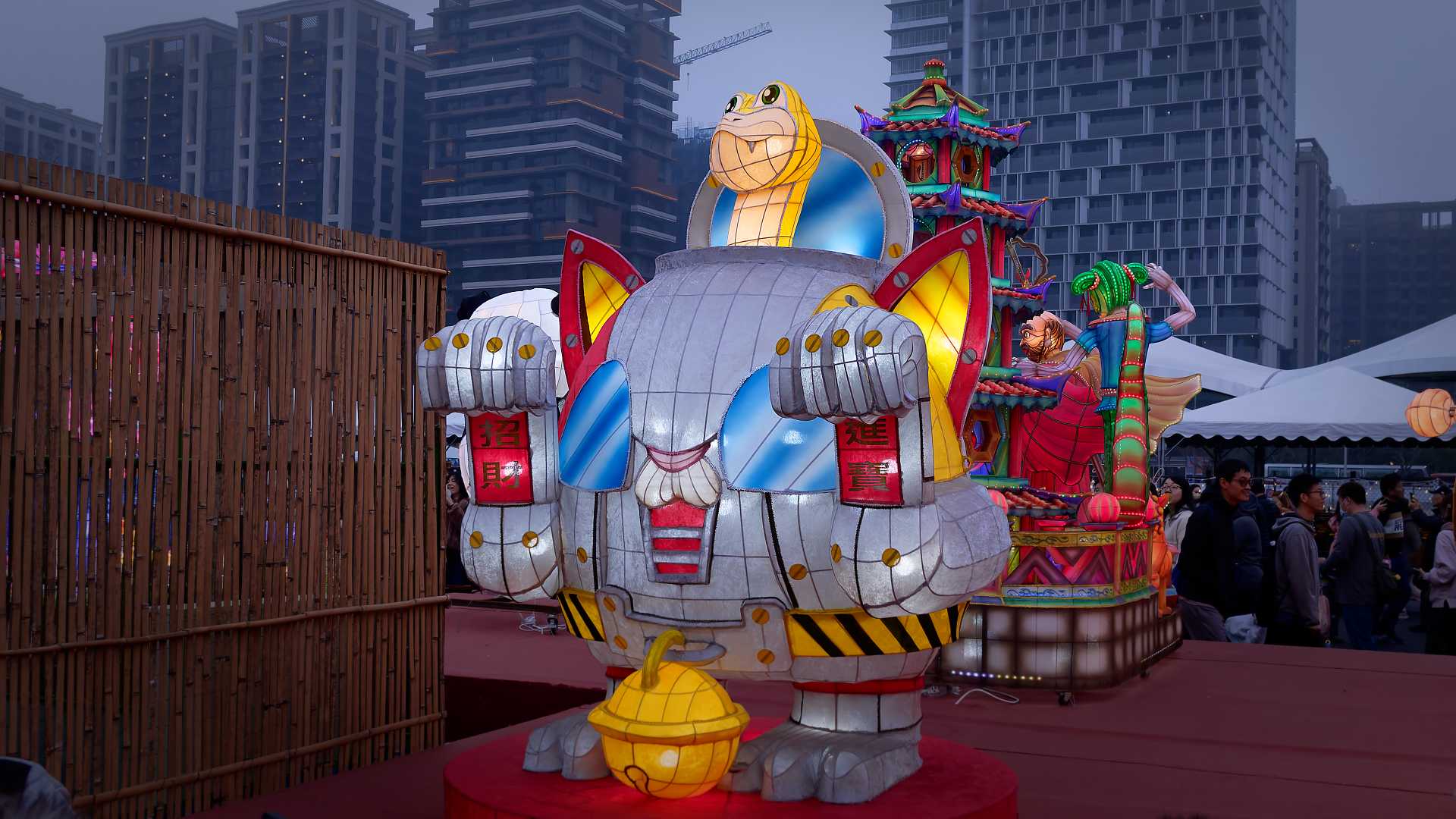 Lantern in the shape of a snake driving a large robot suit.