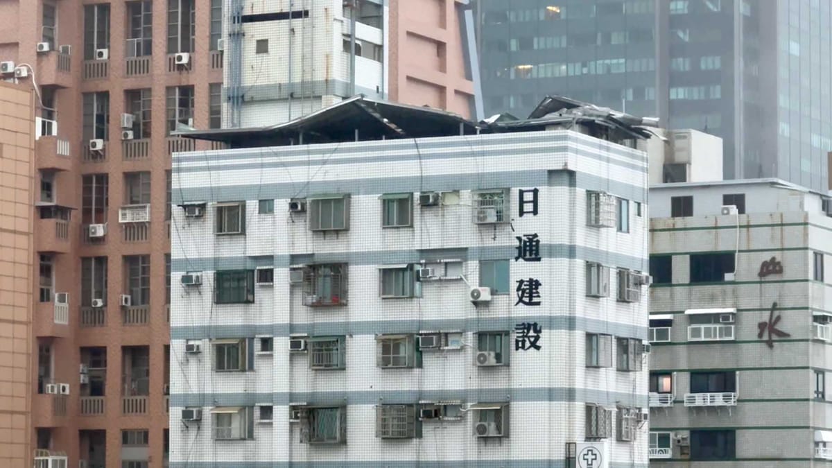 The metal canopy-style roof detaching from the top of a Kaohsiung apartment building during Typhoon Krathon.