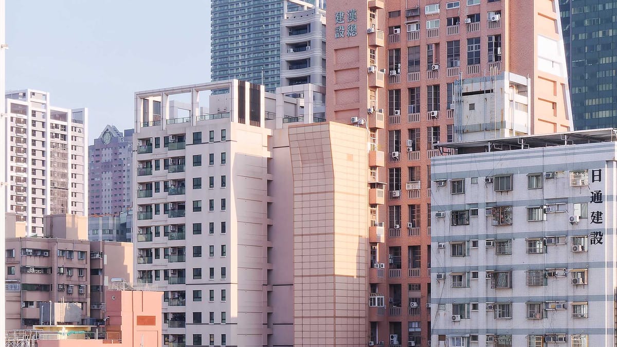 View of a dense group of around a dozen tall apartment buildings in Lingya District, Taiwan.